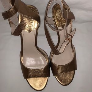Gold high heel pumps